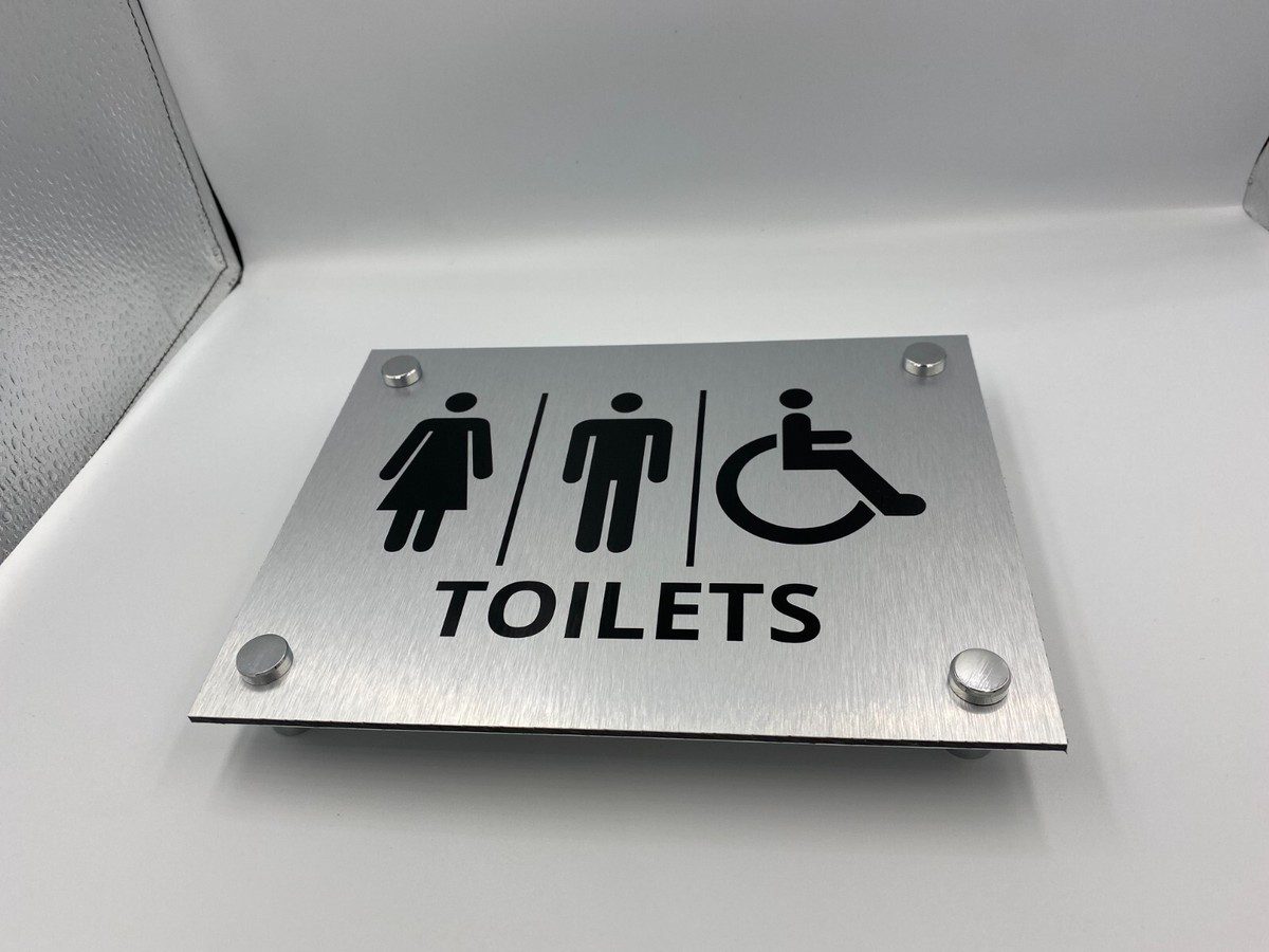 Placa de señalética de baños en aluminio fabricada por Señamexsa
